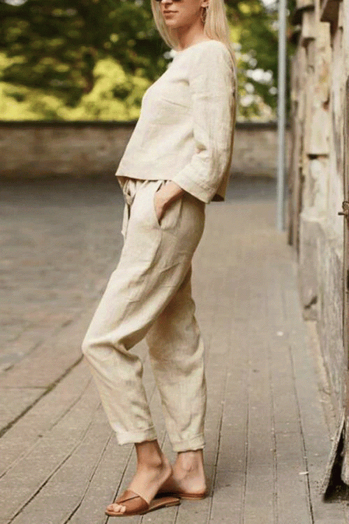 Woman wearing relaxed cotton-linen monochrome longline top and wide-leg pants set outdoors
