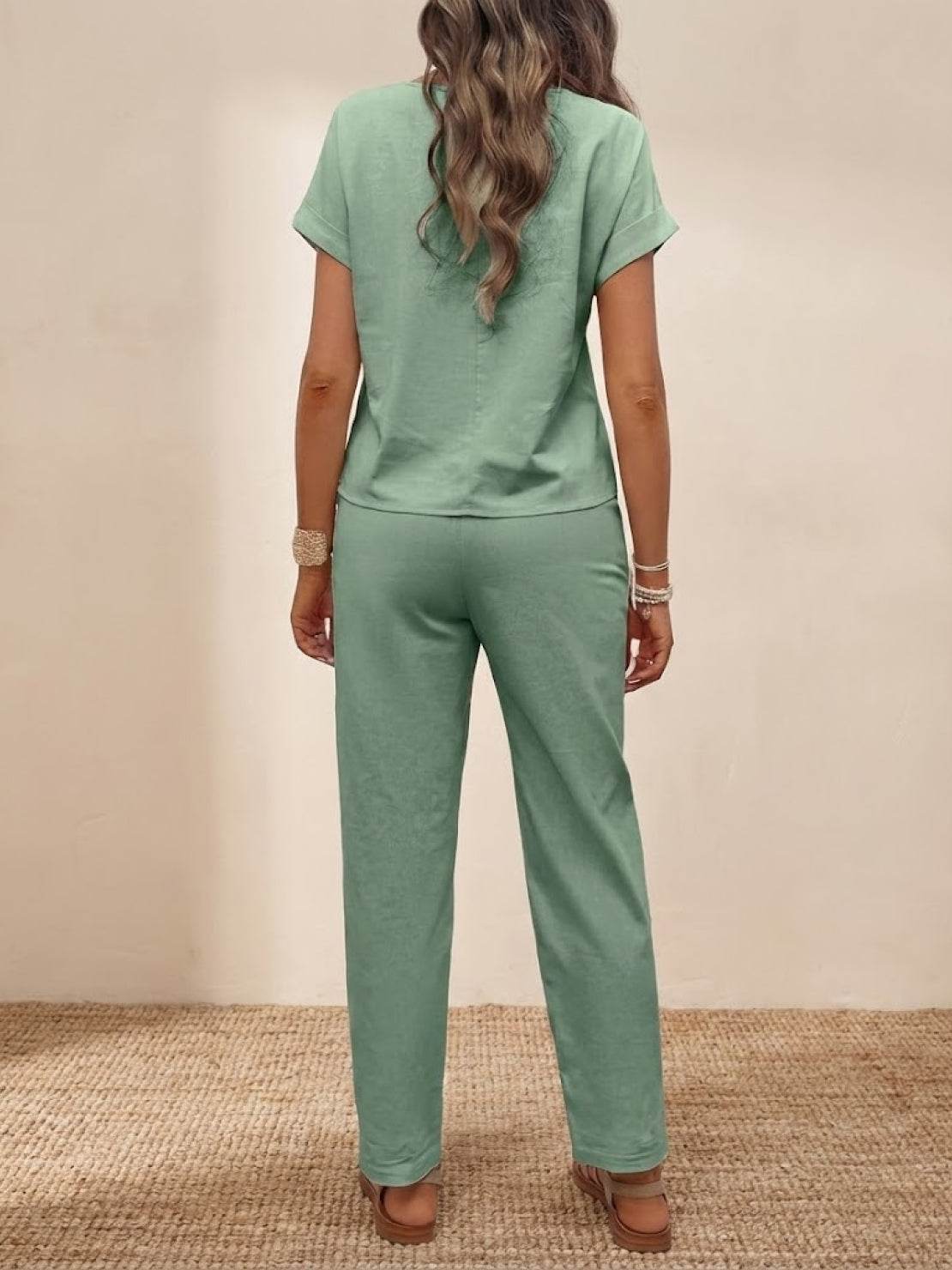 Back view of woman wearing 100% cotton total comfort two-piece set in sage green, perfect for travel and casual wear