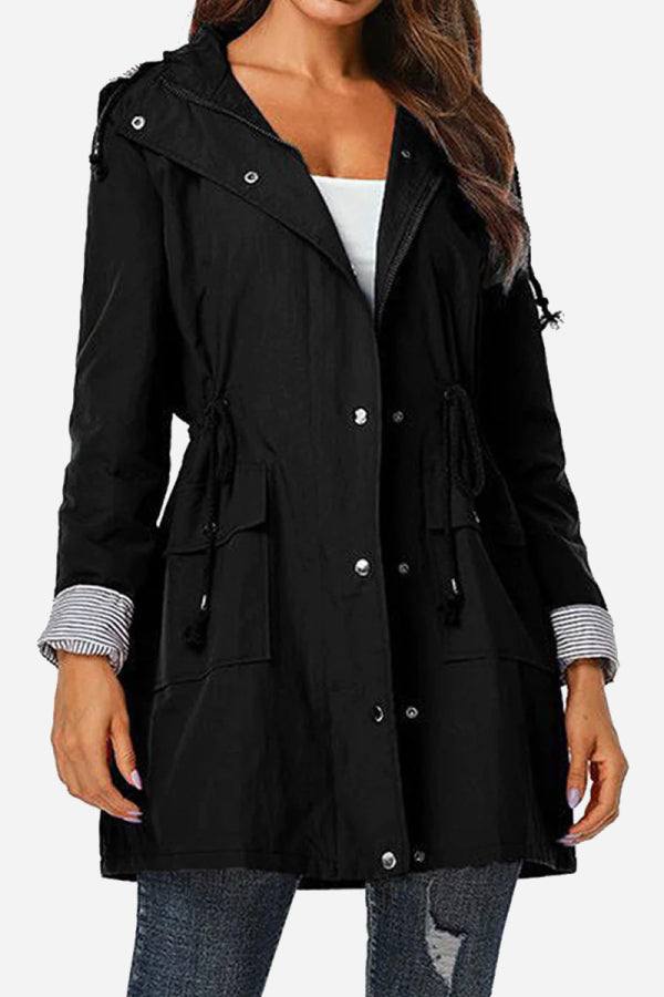 Women's black water resistant windbreaker with hood and striped cuff detail