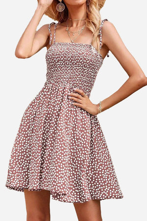 Bohemian skater dress with polka dot pattern, sling knot straps, and elastic top for a comfortable summer fit