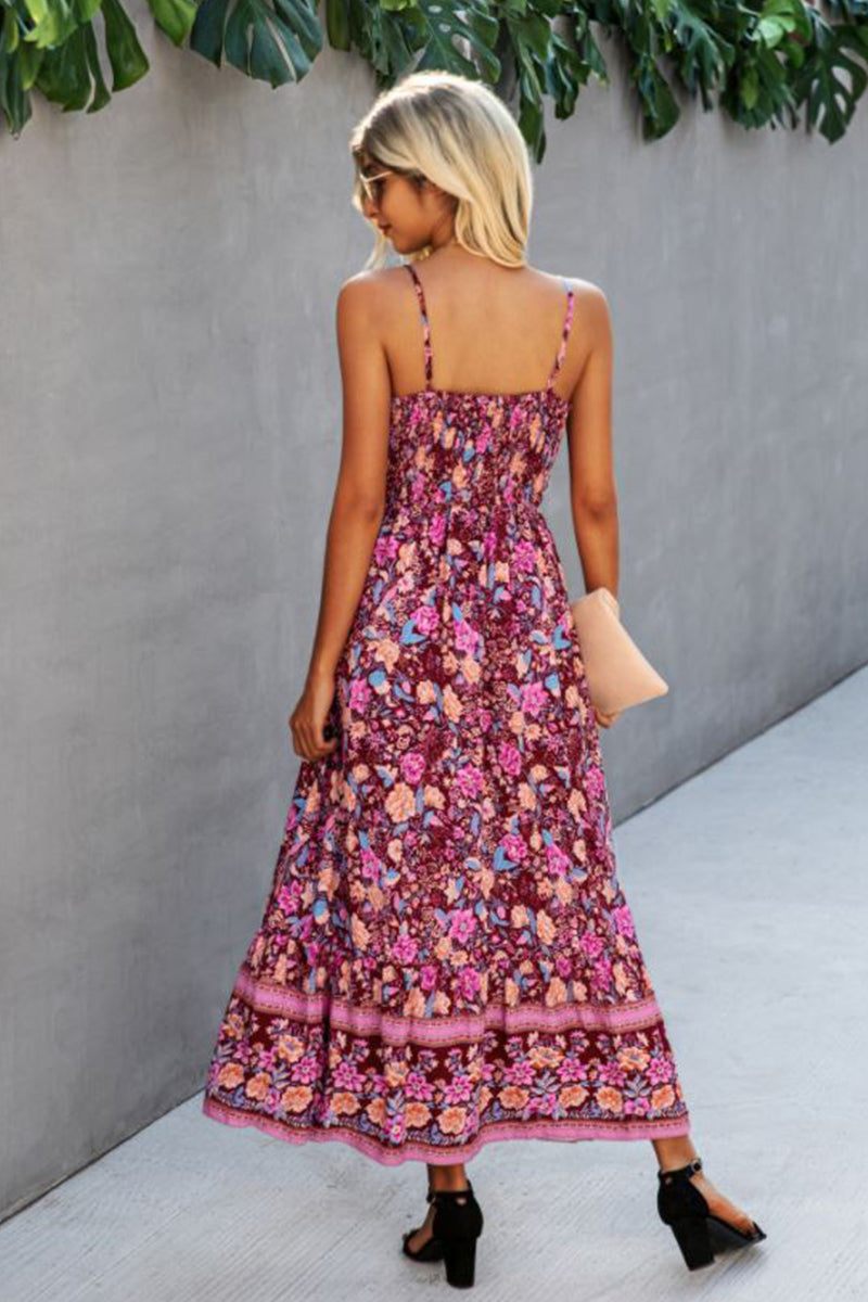 woman wearing vintage flower prints maxi dress with spaghetti straps and elastic waist walking outdoors