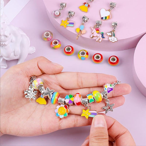 Colorful kids bracelet-making kit with rainbow beads and charm pendants for creative designing