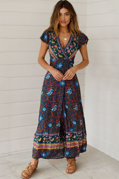 Woman wearing Bohemian floral print wrap dress with V-neck and ruffle skirt