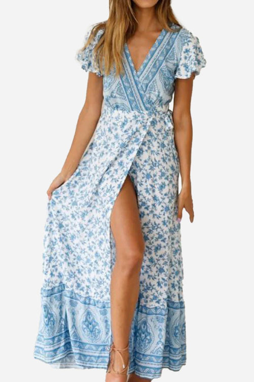 Bohemian floral print wrap dress with V-neck and high slit in blue and white cotton fabric