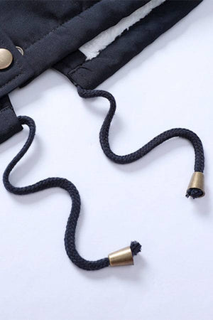 Close-up of black drawstrings with metal tips on thick long-sleeve zipper overcoat