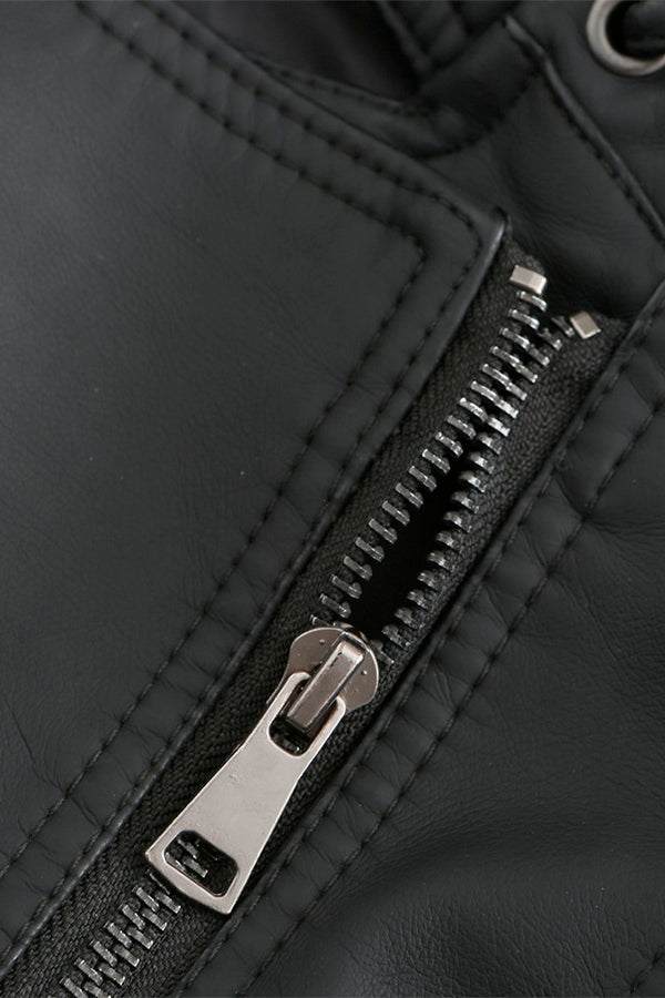 Close-up of zipper detail on slim fit leather motorcycle jacket in black