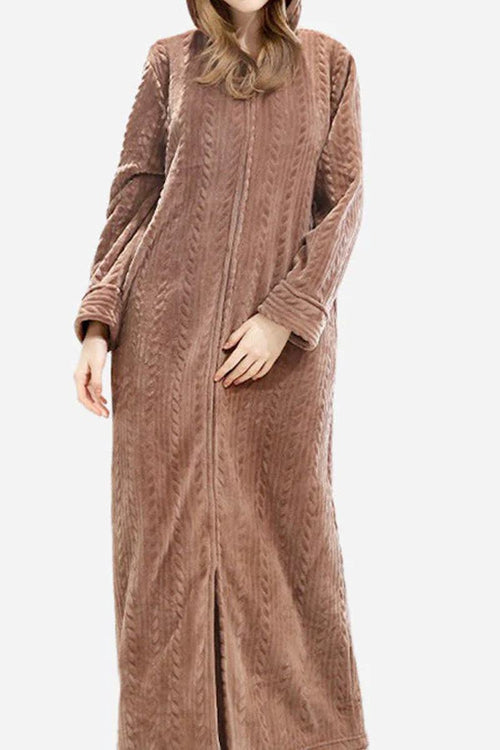 Woman wearing a soft, thick, brown stylish flannel nightgown with a front zipper and long sleeves