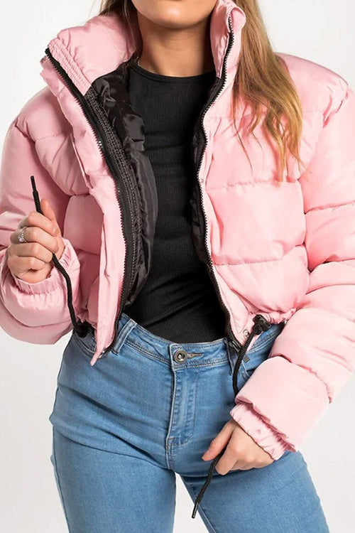 woman wearing pink cropped puffer jacket with zipper and drawstring hem