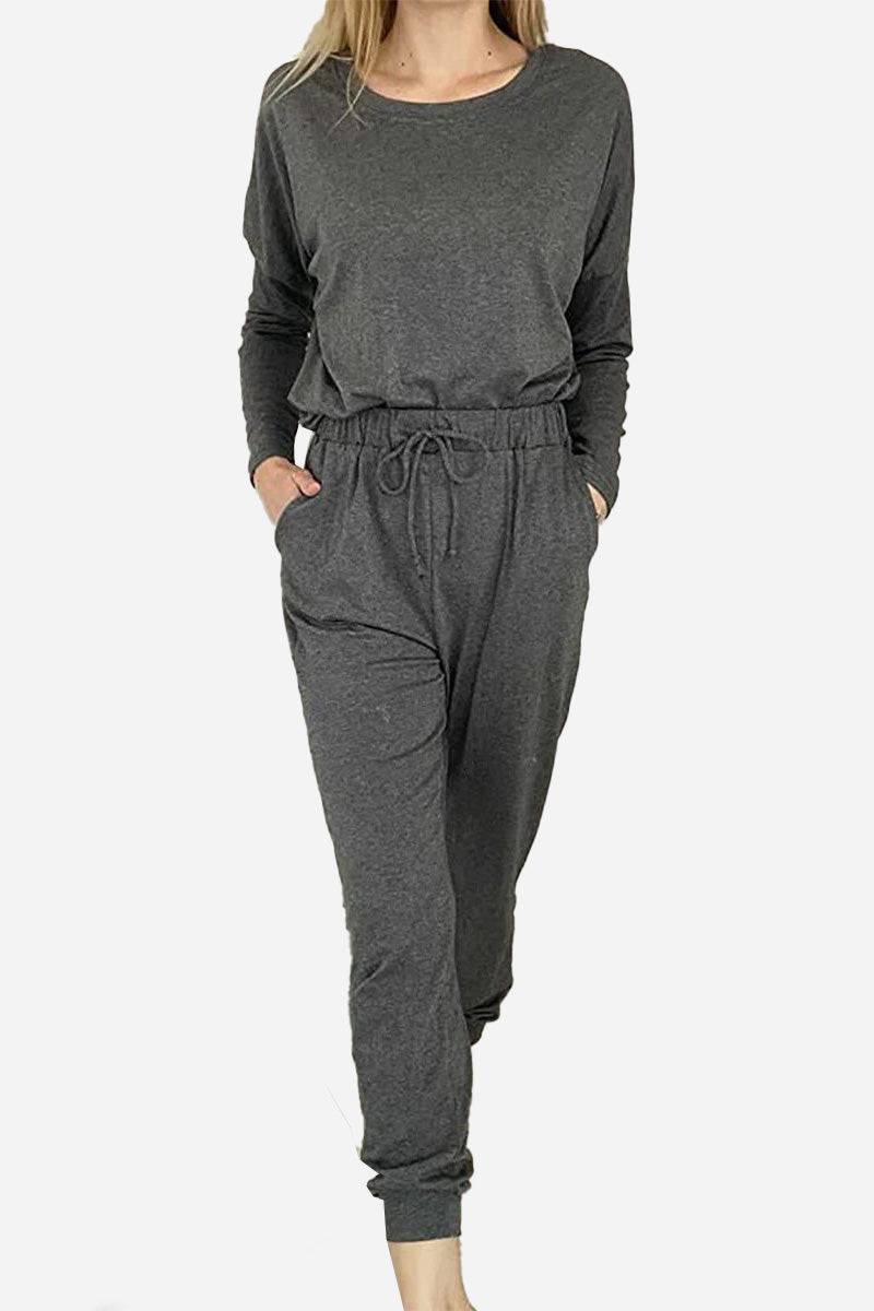 Cozy Chic Two-Piece Sweatsuit set in dark gray with long-sleeve top and high-waisted pants with pockets, perfect for travel and casual wear.