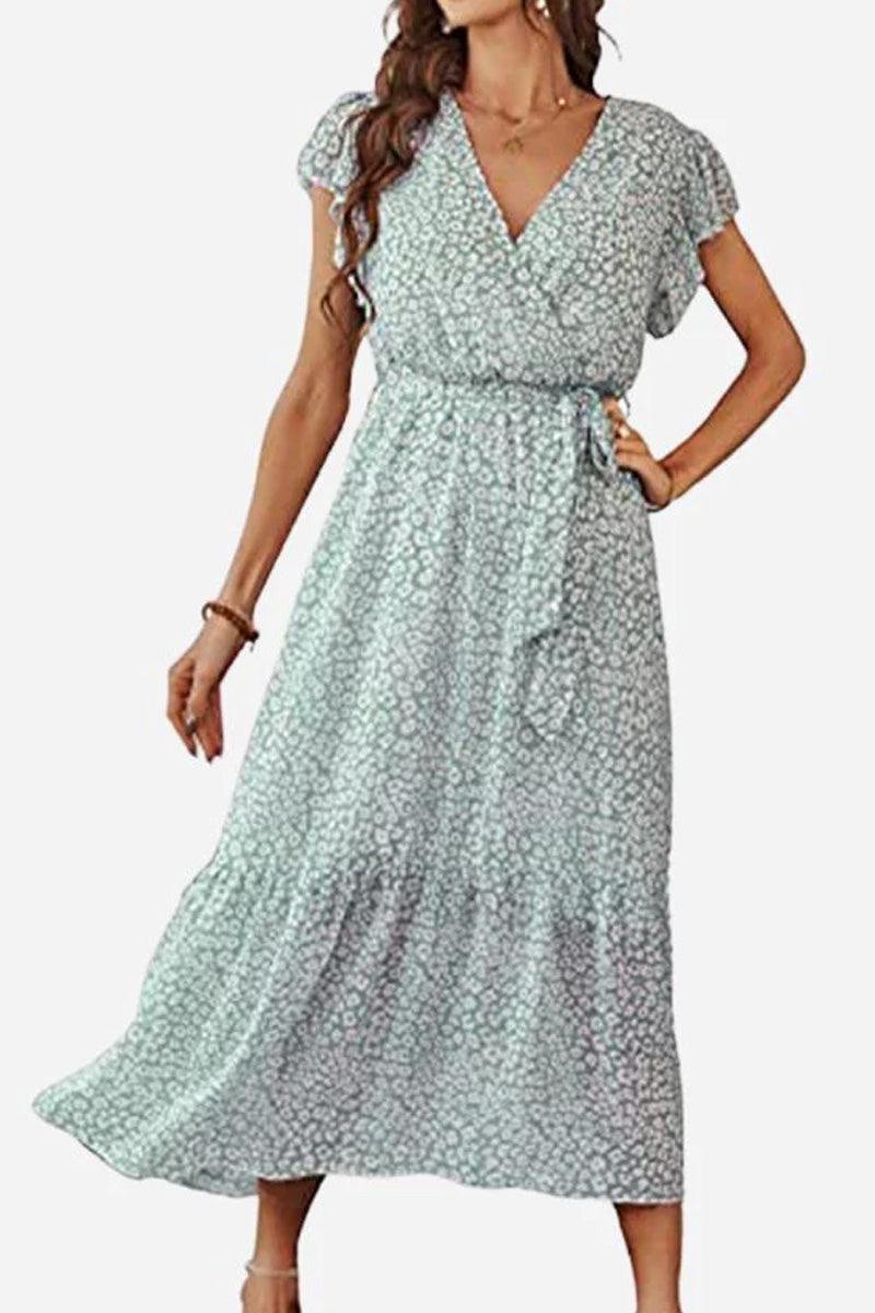 Elegant Blossoms Boho Maxi Dress with floral print, V-neck, short sleeves, adjustable belt, and ruffled hem in soft pastel colors.