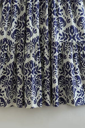 Close-up of blue floral pattern on fabric of Blue Floral Lantern Sleeves Midi Dress made of 100% polyester