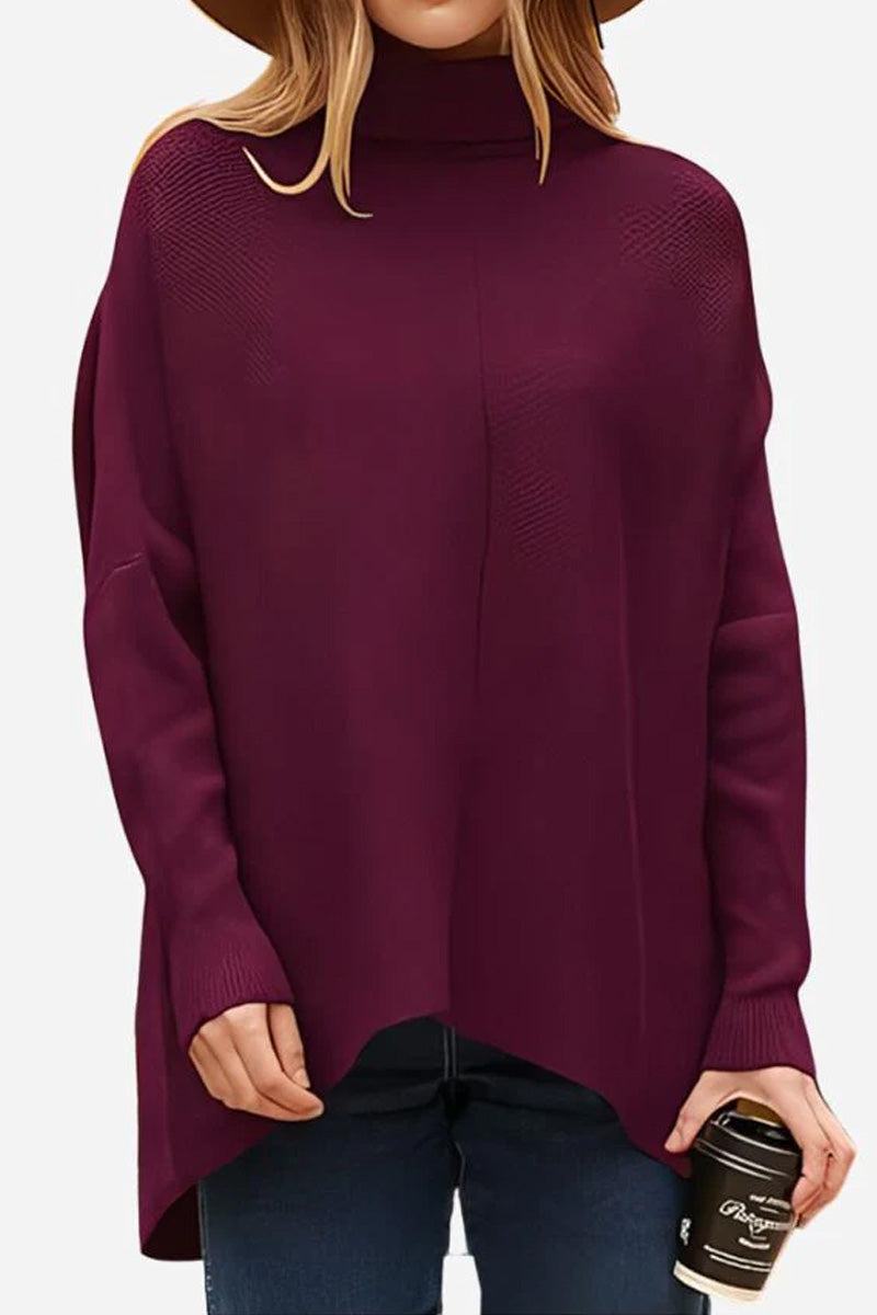 Cozy Oversized Knit Pullover in burgundy with high neck and long sleeves, styled with jeans and holding a coffee cup.