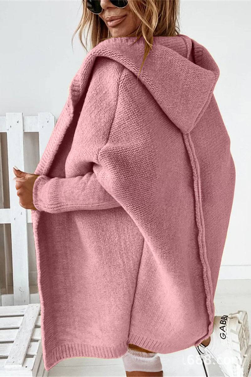 Pink warm oversized hooded cardigan with relaxed fit and soft knit fabric worn by woman