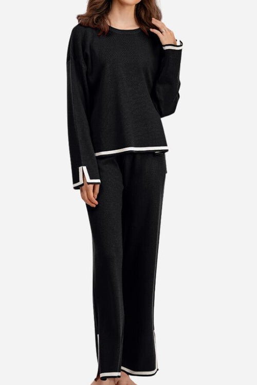 Long sleeved relaxed fit black lounge set with white trim and wide-leg pants