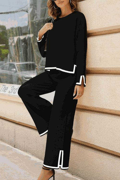 Long sleeved relaxed fit black lounge two-piece set with white trim and wide-leg pants for casual chic style