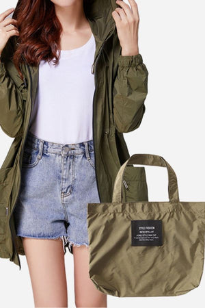 Travel ready outdoor raincoat windbreaker in olive green with matching compact storage bag