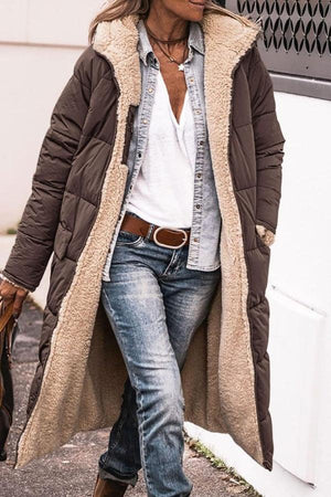 woman wearing brown sherpa-lined hooded teddy coat with denim outfit outdoors