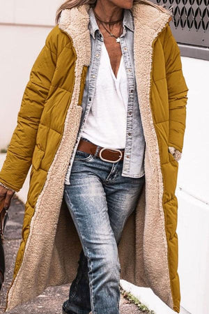 Sherpa-lined hooded teddy coat in mustard yellow with cozy sherpa fleece interior and puffer exterior, styled with casual denim and white top.
