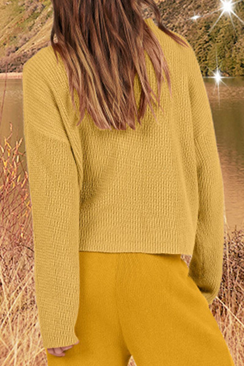 woman wearing mustard yellow relaxed knit sweater and trouser set in natural outdoor setting reflecting European minimalism style