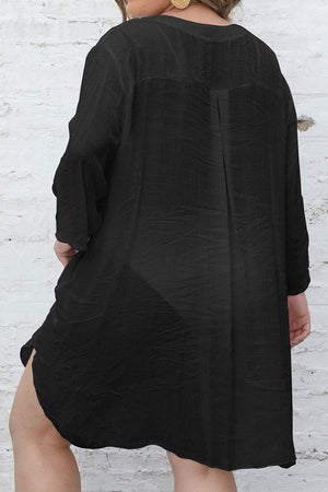 Black airy V-neck tunic with 3/4 sleeves and asymmetrical hem, loose fit from back view