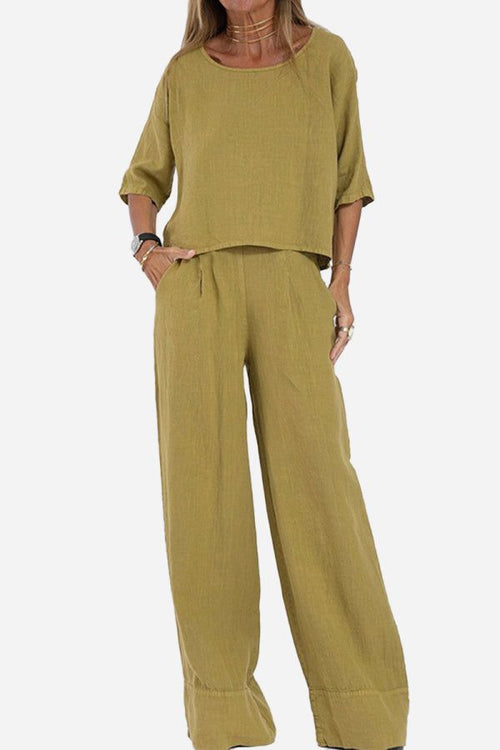 Women’s short-sleeved pullover and wide trouser matching set in mustard yellow cotton fabric with deep pockets and relaxed fit