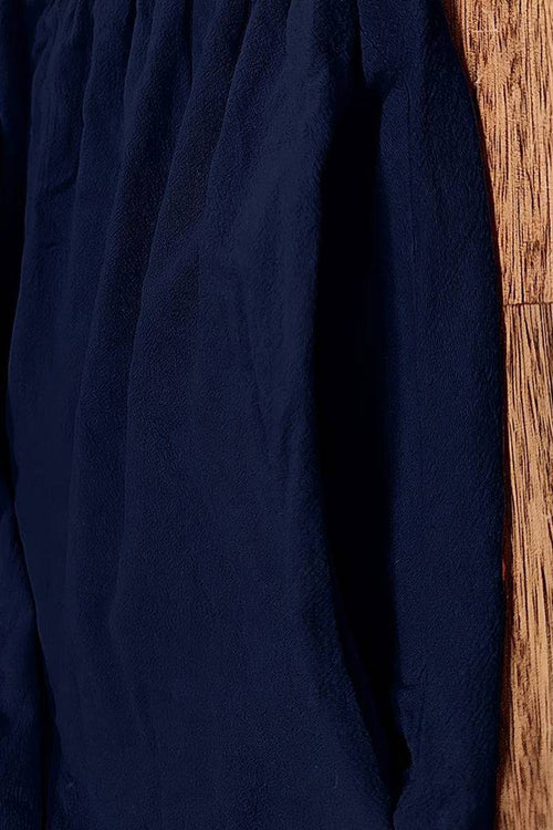 Navy capped-sleeve voluminous pleated midi dress with breathable fabric and pocket detail