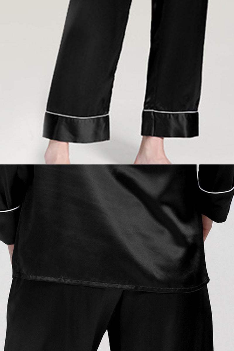 Black long sleeve silk pajamas with contrast piping on cuffs and relaxed fit pants