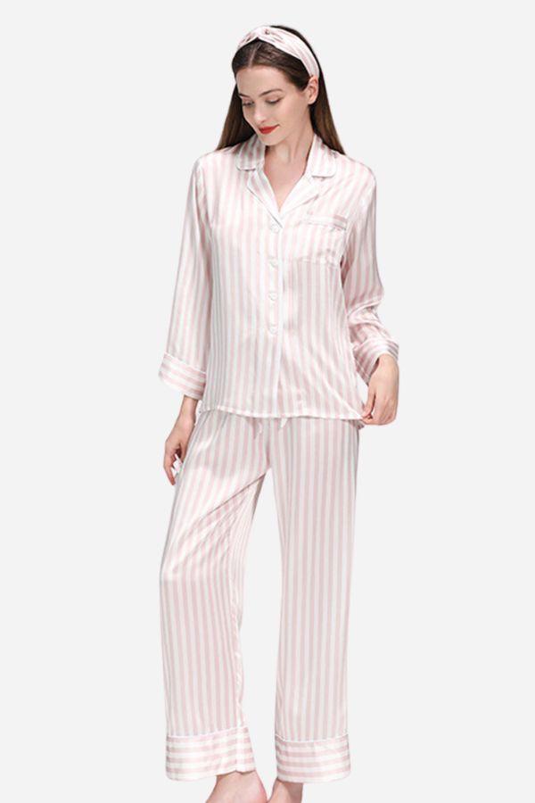 Woman wearing 100% mulberry silk striped long sleeve pajama set with matching pants and headband