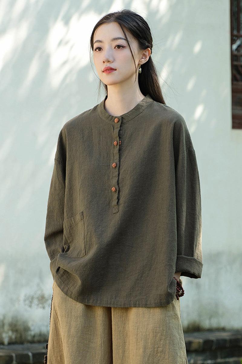 Women wearing olive green ramie linen and cotton blouse with buttoned front and relaxed fit outdoors