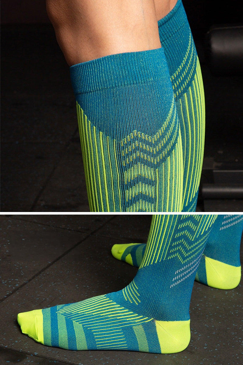 Premium compression socks in blue and green with gradual compression design for travel and leg fatigue relief