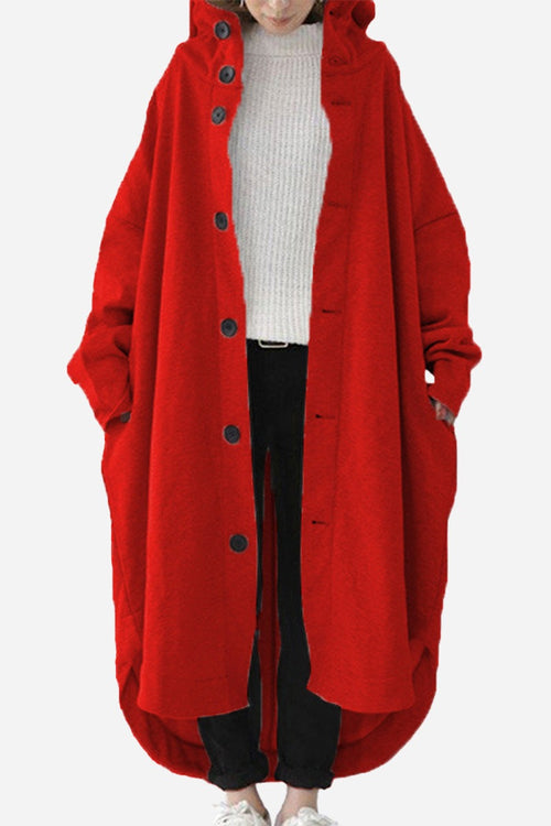 Woman wearing a red oversized everyday buttoned hooded coat with roomy pockets and relaxed fit