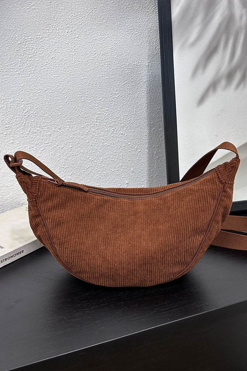 Brown corduroy shoulder bag with adjustable strap and zip closure, soft textured fabric, compact and stylish everyday handbag