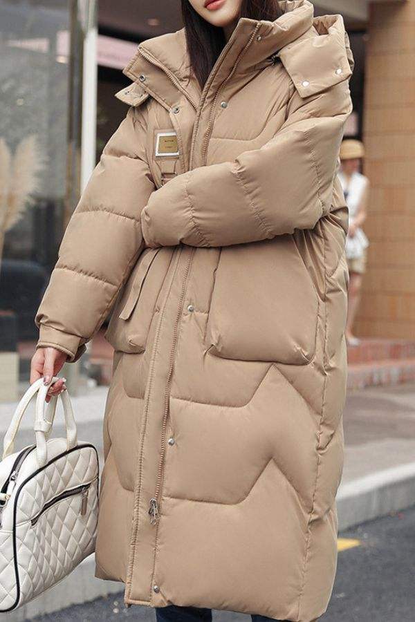 Beige FrostLine Long Coat, insulated lightweight winter coat with hood and deep pockets for cold weather travel and layering.