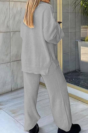 Woman wearing gray Travel-Ease Two-Piece Set with relaxed fit and long sleeves, standing outdoors near glass door