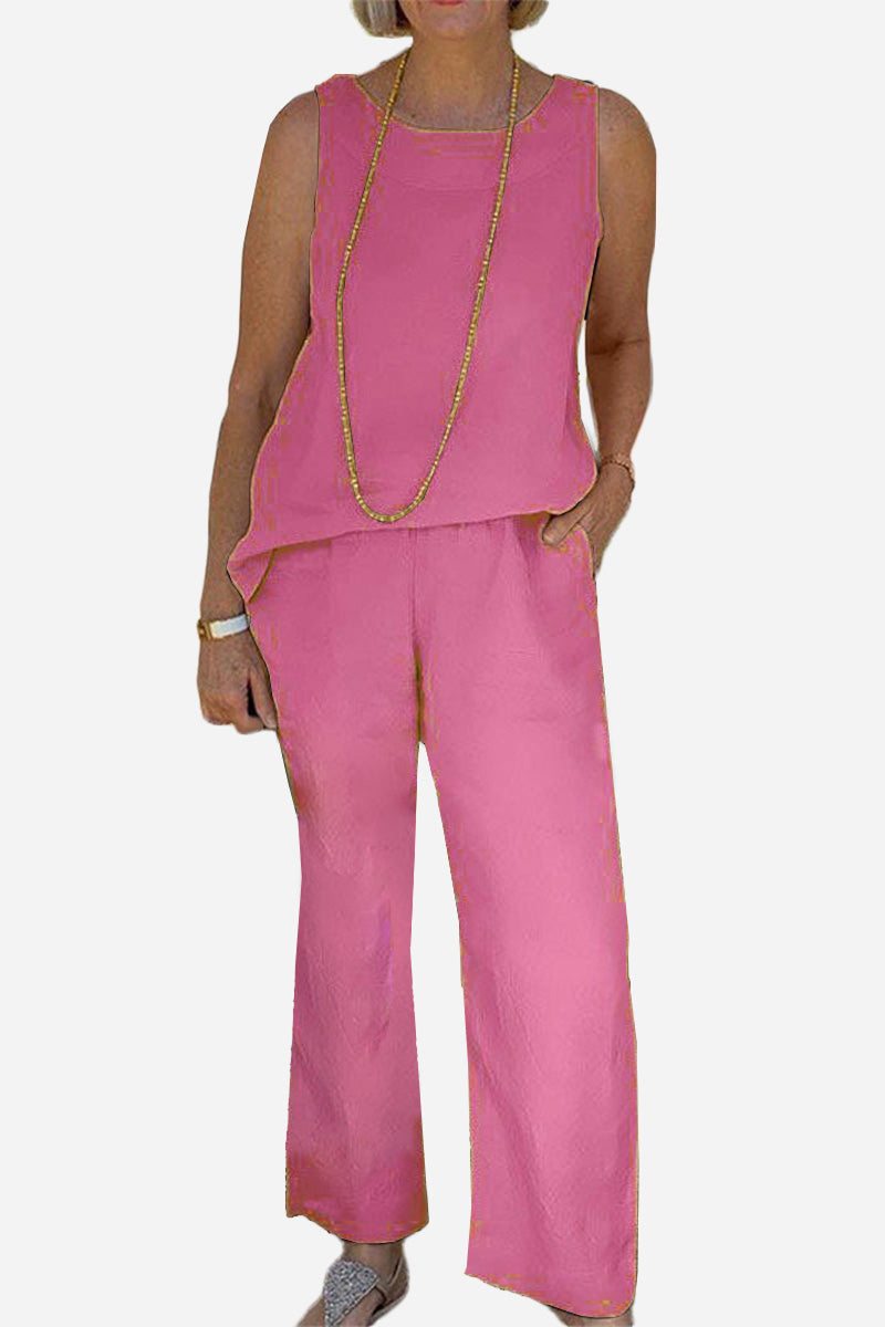 Sleek silhouette pink sleeveless coordinated set with wide-leg pants and lightweight fabric.