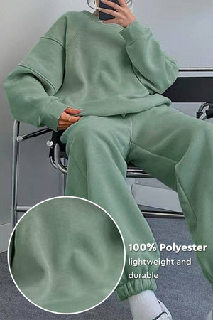 Green comfy chic tracksuit made of lightweight polyester, featuring relaxed fit and casual style for lounging or errands.