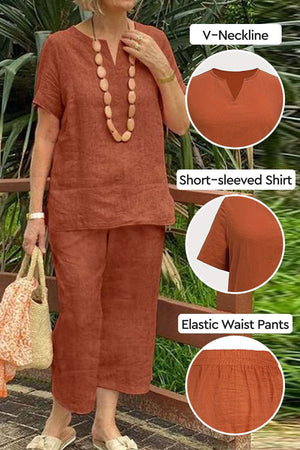 Woman wearing rust-colored breezy cotton blend two-piece set with V-neck short-sleeved shirt and elastic waist pants.