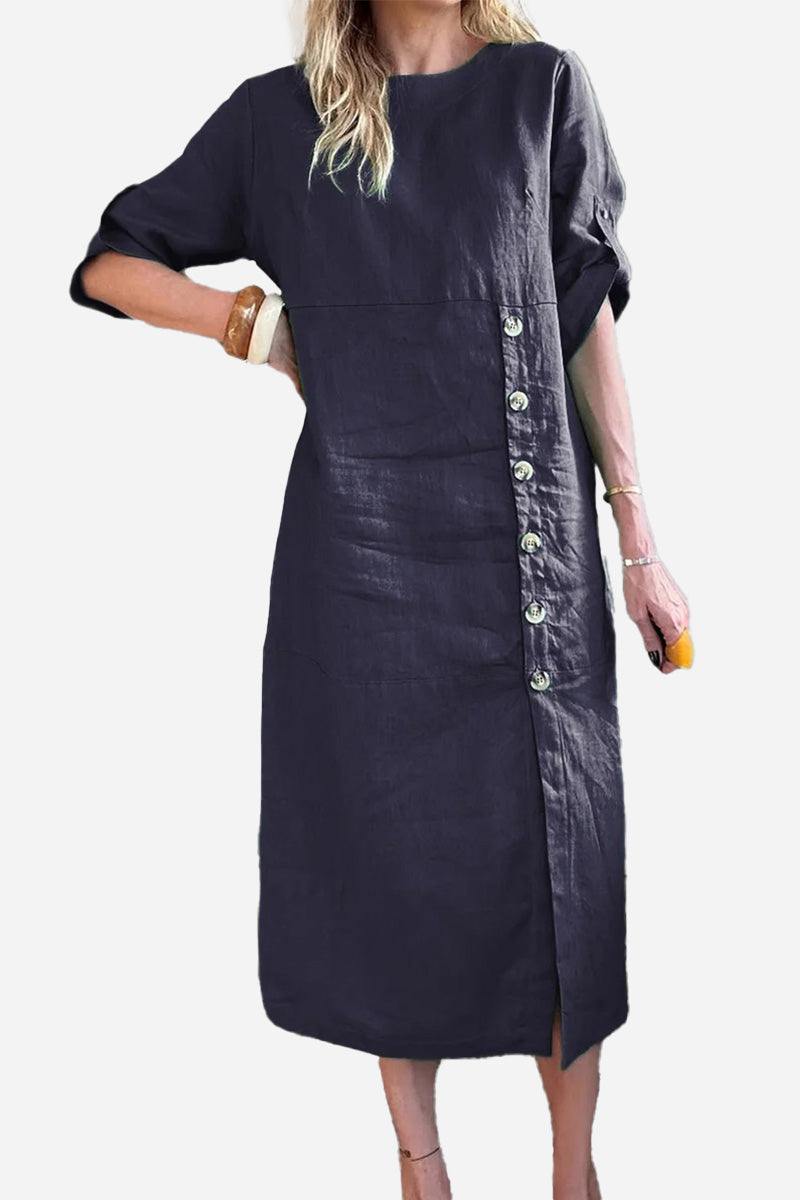 Woman wearing a navy blue Pure Cotton Elegance dress with side buttons and mid-length sleeves
