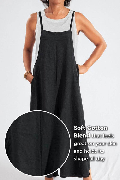 Woman wearing black cotton blend comfort jumpsuit with wide-leg design and sleeveless cut