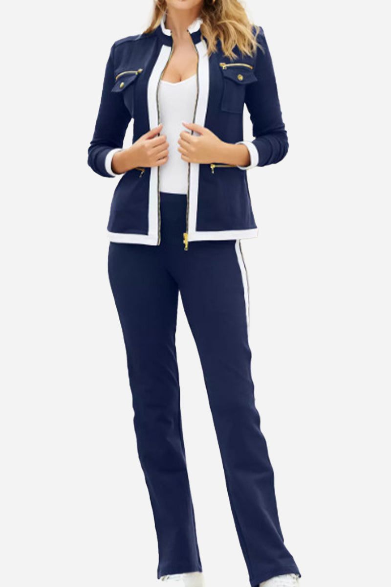 woman wearing navy contrast zip two-piece with white trim and fitted pants
