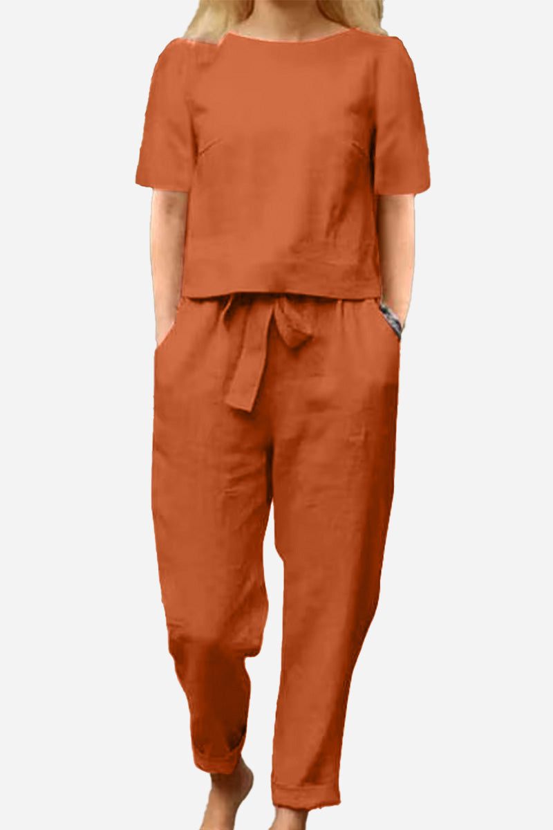 Woman wearing rust-colored cotton-linen blend monochrome two-piece set with short sleeves and relaxed fit pants