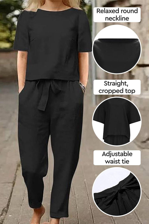 Black cotton-linen blend two-piece set with relaxed round neckline, cropped top, and adjustable waist tie.