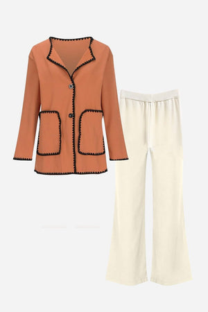 Coral mix and match contrast-trim knit cardigan and cream pants set for versatile comfortable wear.