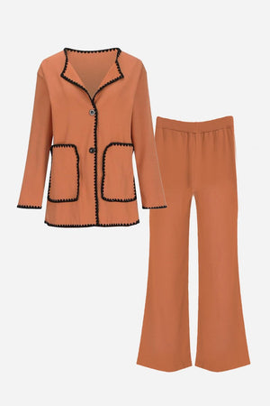 Women's coral mix and match contrast-trim knit cardigan set with black edging, featuring button-front cardigan and matching pants