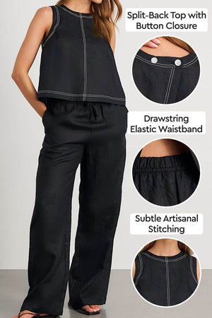 Woman wearing black cotton-linen relaxed two-piece set with split-back top, button closure, elastic drawstring waistband, and subtle artisanal stitching.