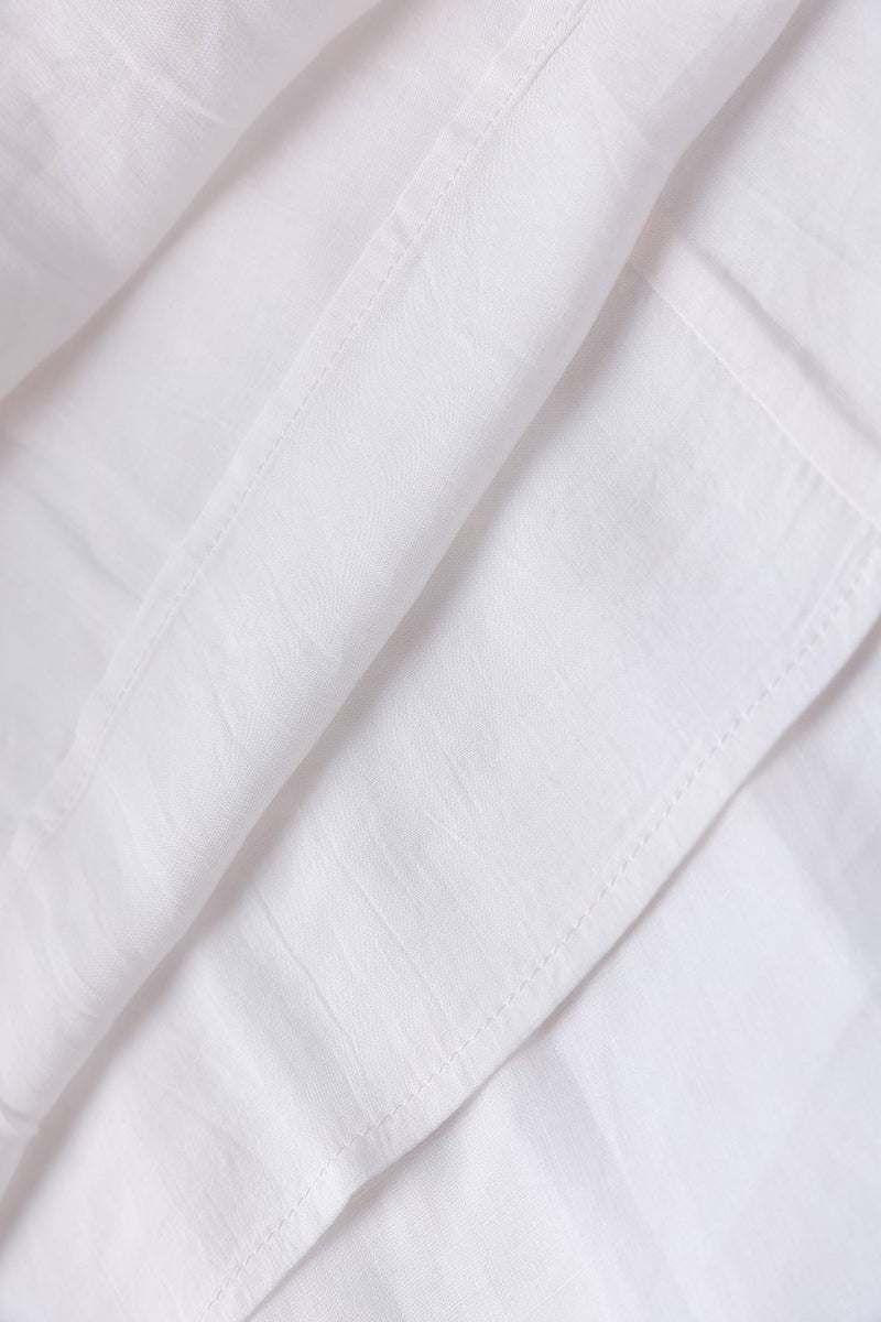 close-up of white 100% linen fabric texture for coastal shift dress