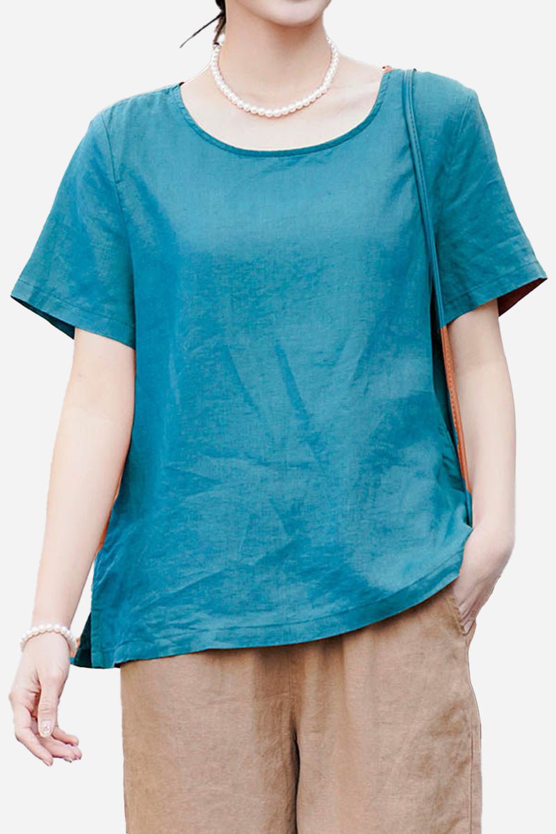 Woman wearing a breathable 100% pure linen classic blue shirt with short sleeves and relaxed fit