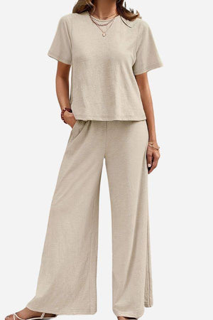 Beige Riviera Relaxed Two Piece Set with short sleeve top and wide-leg pants for comfortable travel and casual wear