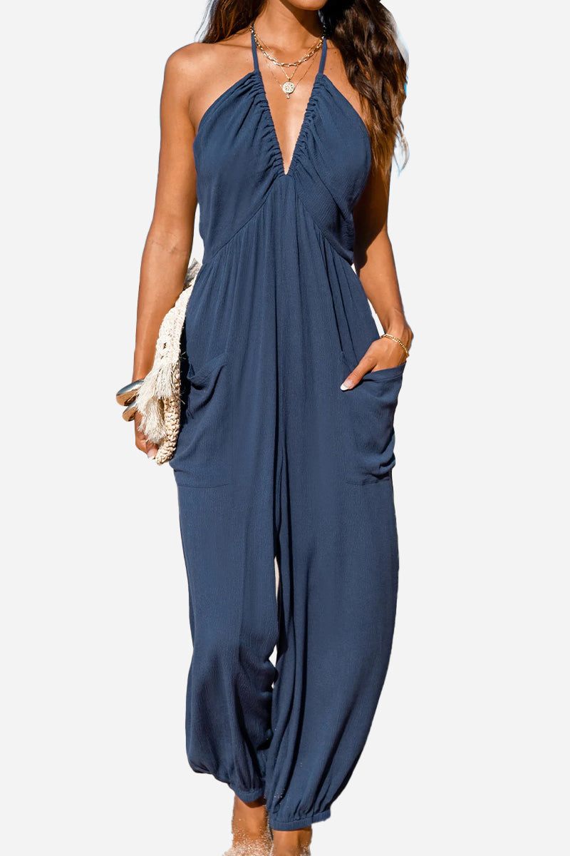 Sunshine On Sand navy halter-neck jumpsuit with ruched neckline and elastic ankle cuffs