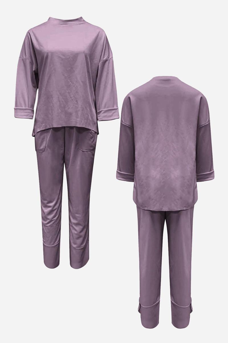 Purple two-piece set with crew neck sweatshirt and jogger pants, wrinkle-resistant polyester for casual comfort and style.